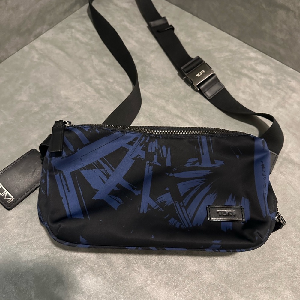 Tumi Black and Blue Belt Bag with Tropical Pattern